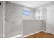 Bright bathroom features a marble-tiled shower with glass door and window at 4253 Ironclad Dr, Bargersville, IN 46106