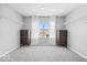 Spacious walk-in closet features plush carpeting, ample shelving, and natural light from a central window at 4253 Ironclad Dr, Bargersville, IN 46106