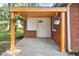 Charming back porch featuring flower pots, brick walls, and awning at 4502 Evanston Ave, Indianapolis, IN 46205