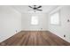 Well lit bedroom with new flooring and modern ceiling fan at 4502 Evanston Ave, Indianapolis, IN 46205