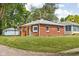 Charming brick house with green lawn in a quiet neighborhood at 4502 Evanston Ave, Indianapolis, IN 46205