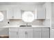 Updated kitchen featuring a stainless steel sink and mosaic tile backsplash at 4502 Evanston Ave, Indianapolis, IN 46205