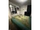 Bedroom featuring green bedding, full-length mirror, and mounted televisions at 4744 E 33Rd St, Indianapolis, IN 46218