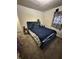 Bedroom featuring blue upholstered furniture and carpeting at 4744 E 33Rd St, Indianapolis, IN 46218