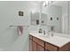 Bathroom features a wide mirror over vanity, a sink, and a soft towel on rack at 5011 Amber Creek Pl # 310, Indianapolis, IN 46237