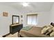 Cozy bedroom with a dresser, window, and warm, neutral color scheme at 5011 Amber Creek Pl # 310, Indianapolis, IN 46237