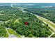 Stunning aerial view of a secluded property surrounded by lush greenery, offering privacy and tranquility at 5055 Turkey Track Rd, Martinsville, IN 46151