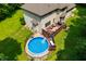 Aerial view of backyard featuring a deck with outdoor furniture and above-ground swimming pool at 5055 Turkey Track Rd, Martinsville, IN 46151