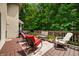 Charming back deck features comfortable seating, a grill, and lush greenery, creating a serene outdoor space at 5055 Turkey Track Rd, Martinsville, IN 46151