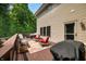 Relaxing back deck features outdoor seating, a grill, and wooded surroundings, perfect for entertaining at 5055 Turkey Track Rd, Martinsville, IN 46151