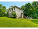 Exterior view of back yard and pool with black chain link fencing at 5055 Turkey Track Rd, Martinsville, IN 46151