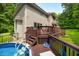 Scenic backyard showcasing a pool, deck, and well-maintained landscaping, perfect for outdoor living at 5055 Turkey Track Rd, Martinsville, IN 46151