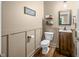 Charming half-bathroom with modern fixtures, decorative wall art, and a stylish vanity at 5055 Turkey Track Rd, Martinsville, IN 46151