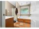 Bathroom features a soaking tub, tiled floors, and glass block window for privacy at 5055 Turkey Track Rd, Martinsville, IN 46151