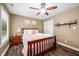 Bedroom features a wood bed, wood floors, two windows, and natural light at 5055 Turkey Track Rd, Martinsville, IN 46151