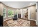 Well-lit bonus room with a large window and an area rug providing an inviting space for relaxation and entertainment at 5055 Turkey Track Rd, Martinsville, IN 46151
