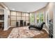 Bonus Room complete with modern lighting, stylish decor, and large windows offering plenty of natural light at 5055 Turkey Track Rd, Martinsville, IN 46151