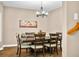 Well-lit dining room features a modern chandelier and warm, neutral colors at 5055 Turkey Track Rd, Martinsville, IN 46151