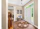 Inviting entryway with hardwood floors, natural light, and a cozy bench at 5055 Turkey Track Rd, Martinsville, IN 46151