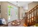 Bright entryway featuring hardwood flooring, staircase, and front door at 5055 Turkey Track Rd, Martinsville, IN 46151
