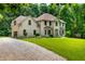 Charming two-story home with attached garage and a lush green lawn at 5055 Turkey Track Rd, Martinsville, IN 46151