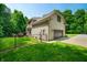 Back exterior view featuring a deck, fenced in yard and garage at 5055 Turkey Track Rd, Martinsville, IN 46151