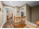 Hallway features wood floors, and open doorway to a bedroom and walk-in closet at 5055 Turkey Track Rd, Martinsville, IN 46151