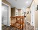 Long hallway featuring wood floors, and a wood railing to the lower level at 5055 Turkey Track Rd, Martinsville, IN 46151