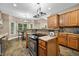 Bright kitchen featuring wood cabinets, granite countertops, stainless appliances, and eat-in area at 5055 Turkey Track Rd, Martinsville, IN 46151