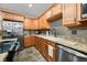 Traditional kitchen with stainless steel appliances, ample counter space, and wood cabinetry at 5055 Turkey Track Rd, Martinsville, IN 46151