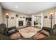 Comfortable living area featuring a fireplace, hardwood floors, and an open layout, perfect for Gathering gatherings at 5055 Turkey Track Rd, Martinsville, IN 46151