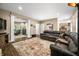 Relaxing living room with hardwood floors, comfortable seating, and an open layout to other rooms in the house at 5055 Turkey Track Rd, Martinsville, IN 46151