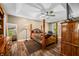 Spacious main bedroom features a tray ceiling, wood floors, and a large window at 5055 Turkey Track Rd, Martinsville, IN 46151