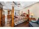 Cozy main bedroom with wood floors, a ceiling fan, and plenty of closet space at 5055 Turkey Track Rd, Martinsville, IN 46151