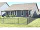 The property boasts a spacious, fully fenced backyard with a young tree, and a cozy covered patio at 5103 Covington Ave, McCordsville, IN 46055