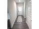 The entryway features hard surface flooring, a patterned rug and a front door with glass at 5103 Covington Ave, McCordsville, IN 46055