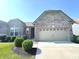 Beautiful single-Gathering home with a two-car garage, manicured lawn, and lush landscaping at 5103 Covington Ave, McCordsville, IN 46055