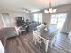 Open living space featuring a dining area, living room, and a sliding glass door that leads to the exterior at 5103 Covington Ave, McCordsville, IN 46055