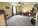 Comfortable and roomy bedroom featuring a large window and a workspace for various activities at 520 Ferndale Ln, Danville, IN 46122