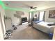 Well-lit bedroom featuring a bed, gaming setup, and decorative LED lights at 520 Ferndale Ln, Danville, IN 46122