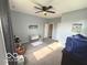 Sun-filled bedroom with a ceiling fan and closet, perfect for relaxation at 520 Ferndale Ln, Danville, IN 46122