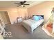 Bright bedroom featuring a cozy bed, ceiling fan, and whimsical teepee corner for creative play at 520 Ferndale Ln, Danville, IN 46122
