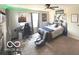 Bedroom with a bed, a gaming setup, a ceiling fan, and natural light from the window at 520 Ferndale Ln, Danville, IN 46122