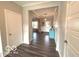 Inviting foyer with hardwood floors and a view into the main living areas at 520 Ferndale Ln, Danville, IN 46122