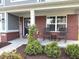 Charming covered porch with rocking chairs and a welcoming 'Welcome' sign at 520 Ferndale Ln, Danville, IN 46122