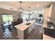 Open kitchen layout with an island, stainless steel appliances, and a dining area at 520 Ferndale Ln, Danville, IN 46122