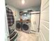 Efficient laundry room with front-load machines, wooden counters, and built-in storage solutions at 520 Ferndale Ln, Danville, IN 46122