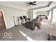 Large living room featuring a sofa, a treadmill, and a view of the adjacent bedroom at 520 Ferndale Ln, Danville, IN 46122
