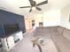 Inviting living room with ceiling fan, modern design, and comfortable seating arrangement at 520 Ferndale Ln, Danville, IN 46122