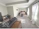 Large main bedroom featuring neutral walls, carpet, and natural light from large windows at 520 Ferndale Ln, Danville, IN 46122